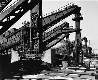 (INDUSTRY) A striking, arty group of 12 dramatic photographs of industrial scenes by Gordon Coster, Arnold Eagle, Ansel Adams, and othe